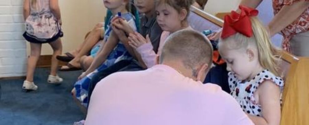 Praying over Christmas Backpacks